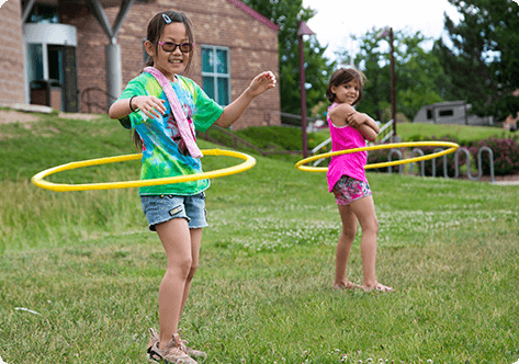 Two girls hula hooping